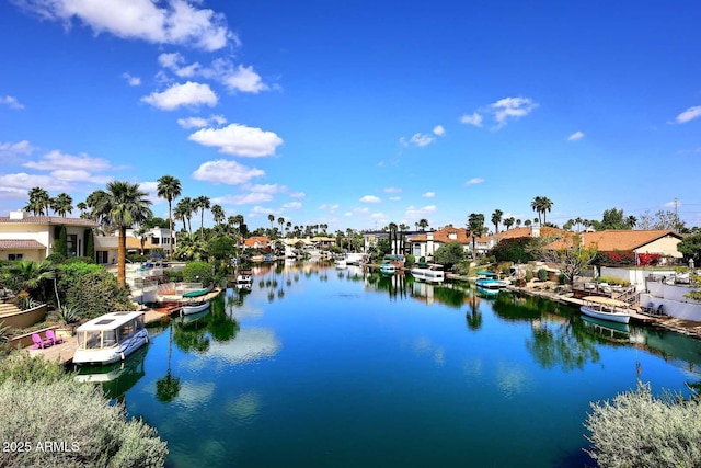 9115 N 101st Way, Scottsdale, AZ 85258 - water view featuring a boat dock and nearby suburban area