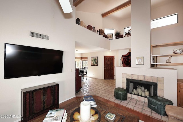 9115 N 101st Way, Scottsdale, AZ 85258 - living area with a towering ceiling, a fireplace, and beam ceiling