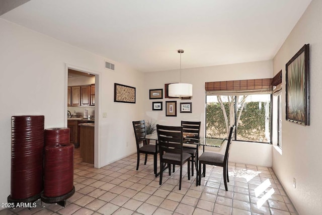 9115 N 101st Way, Scottsdale, AZ 85258 - dining space with light tile patterned floors