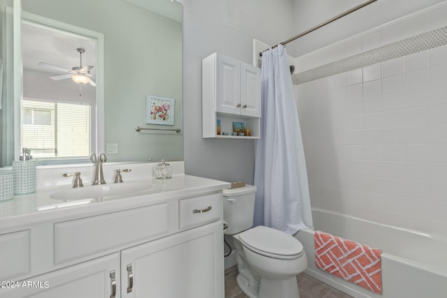 full bathroom with shower / tub combo with curtain, ceiling fan, vanity, and toilet