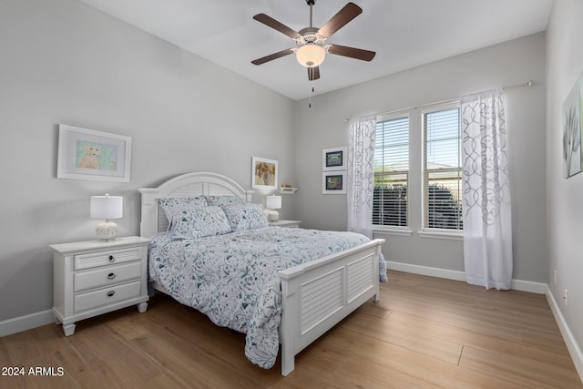 bedroom featuring light hardwood / wood-style floors and ceiling fan