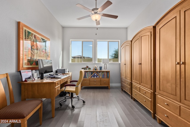 office with ceiling fan and dark wood-type flooring