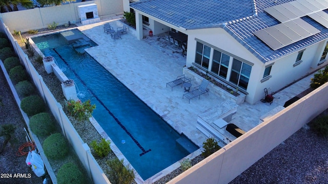 view of swimming pool featuring a patio area