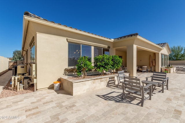 rear view of house with a patio