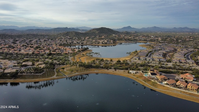 drone / aerial view featuring a water and mountain view