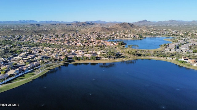 birds eye view of property featuring a water and mountain view