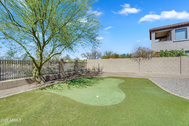 view of yard with a fenced backyard