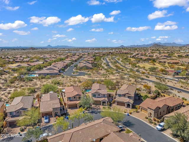 birds eye view of property with a mountain view and a residential view