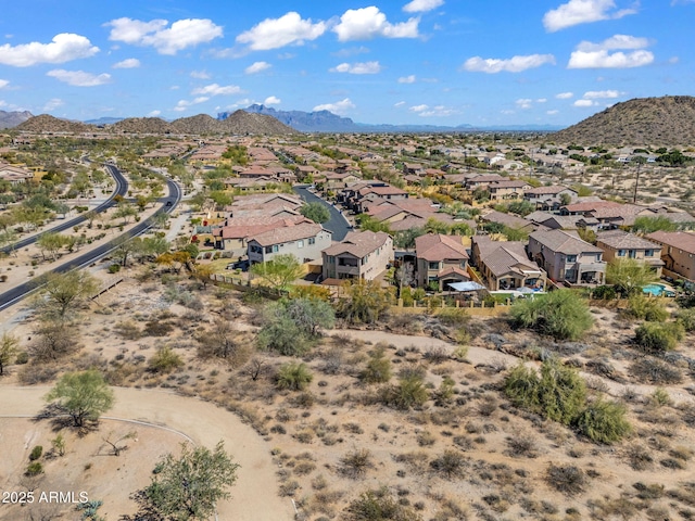 birds eye view of property with a mountain view and a residential view