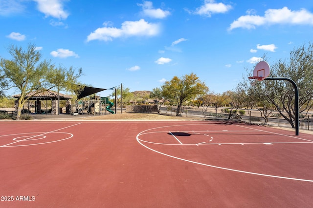 view of sport court featuring a gazebo, playground community, community basketball court, and fence