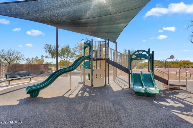 communal playground featuring fence