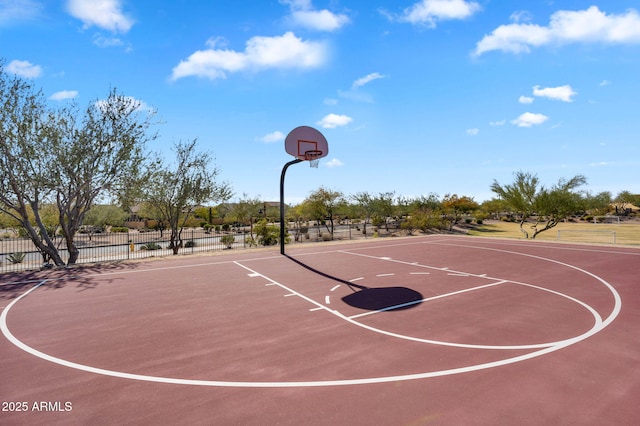 view of basketball court with community basketball court and fence