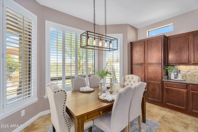 dining area featuring baseboards