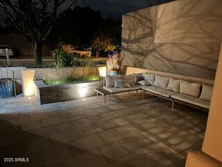 patio at night with outdoor lounge area