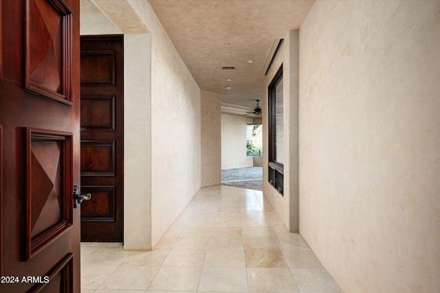 hallway with light tile patterned floors