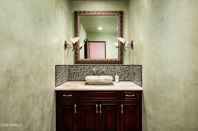 bathroom with vanity and backsplash