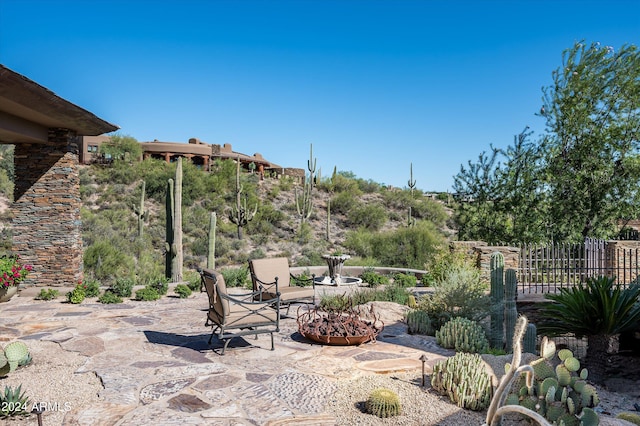 view of patio / terrace with a fire pit