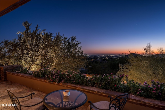 view of patio terrace at dusk