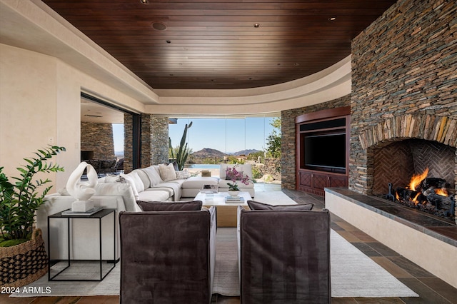 view of patio featuring an outdoor living space with a fireplace