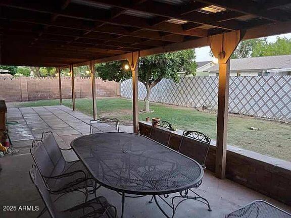 view of patio featuring a fenced backyard and outdoor dining space