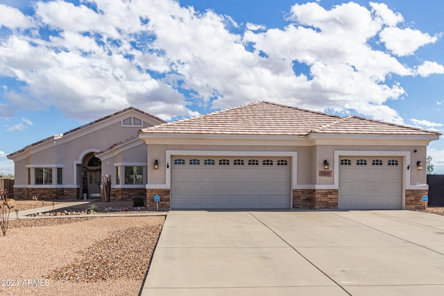 view of front of home with a garage