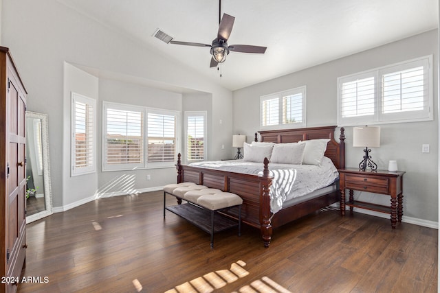 bedroom with ceiling fan, multiple windows, and dark hardwood / wood-style floors