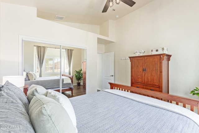 bedroom with hardwood / wood-style flooring, ceiling fan, and vaulted ceiling