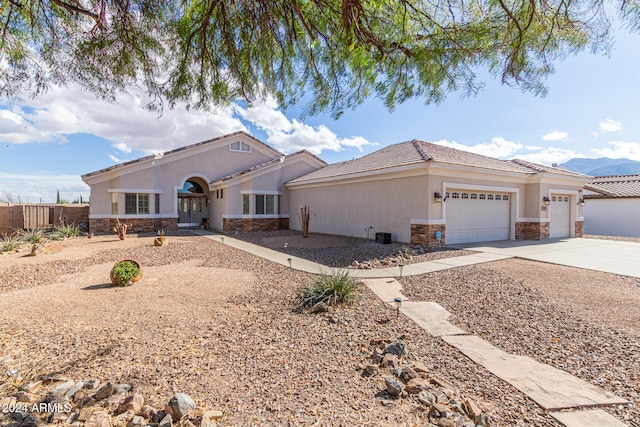 ranch-style house featuring a garage