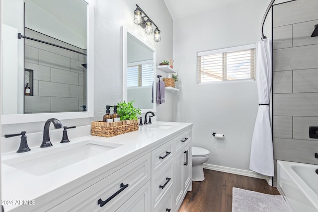 full bathroom featuring toilet, shower / tub combo, vanity, and hardwood / wood-style flooring