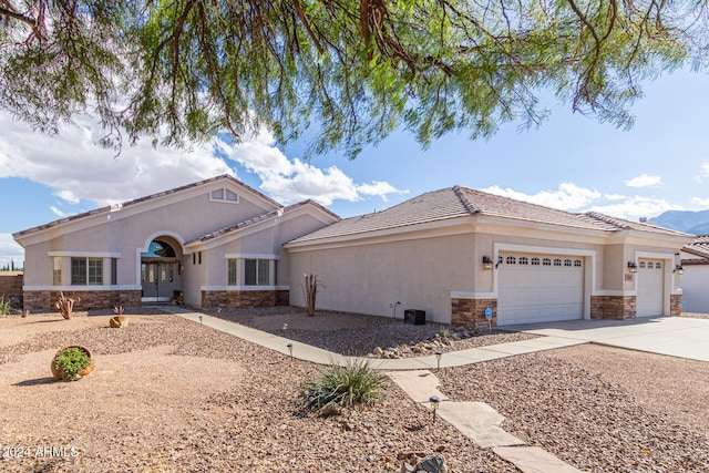 view of front of property with a garage