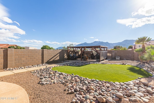 view of yard featuring a mountain view, a gazebo, and a patio area