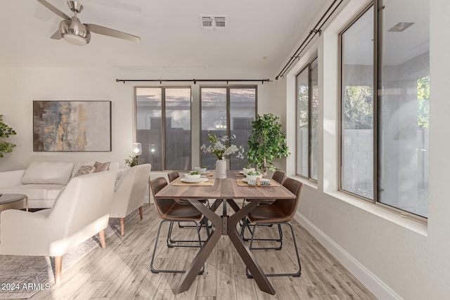 dining space featuring ceiling fan and light hardwood / wood-style flooring