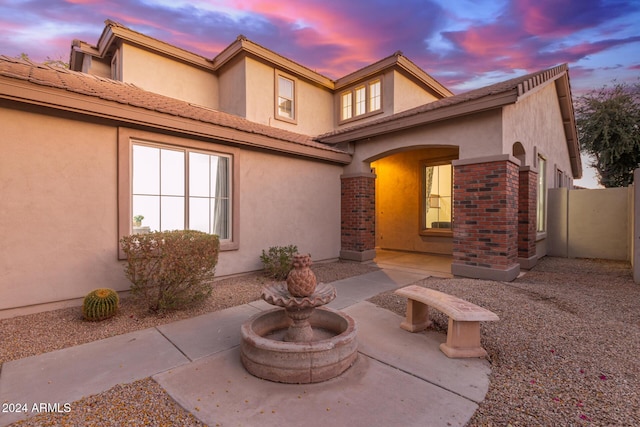 view of front of property featuring a patio area