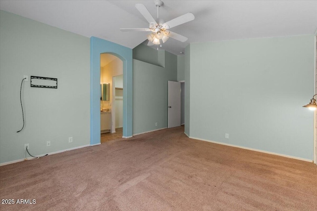 10646 E Enid Ave, Mesa, AZ 85208 - unfurnished bedroom with carpet, arched walkways, vaulted ceiling, baseboards, and a ceiling fan