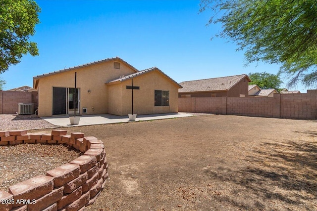 10646 E Enid Ave, Mesa, AZ 85208 - rear view of house featuring central AC, stucco siding, a fenced backyard, and a patio