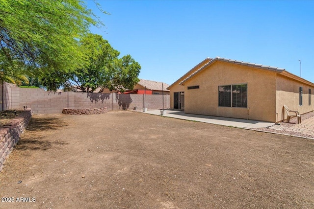 10646 E Enid Ave, Mesa, AZ 85208 - fenced backyard with a patio area