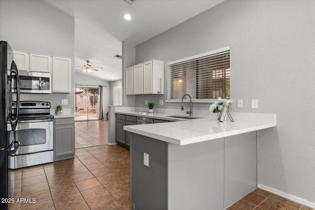10646 E Enid Ave, Mesa, AZ 85208 - kitchen featuring stainless steel appliances, a sink, vaulted ceiling, a peninsula, and a ceiling fan