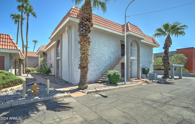 view of property featuring central AC unit