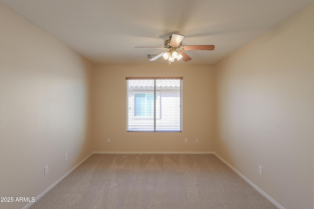 carpeted empty room with ceiling fan