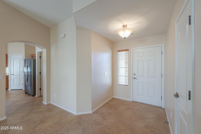 foyer featuring light tile patterned floors