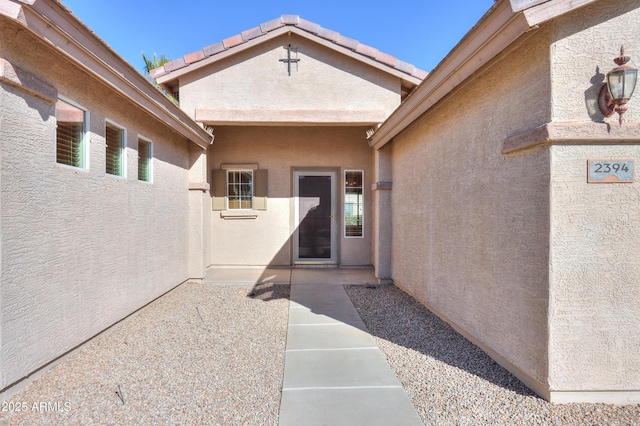 property entrance with a patio