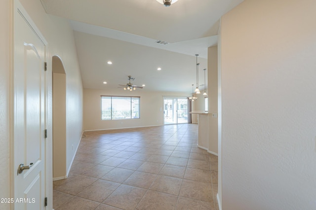 empty room featuring ceiling fan and light tile patterned flooring