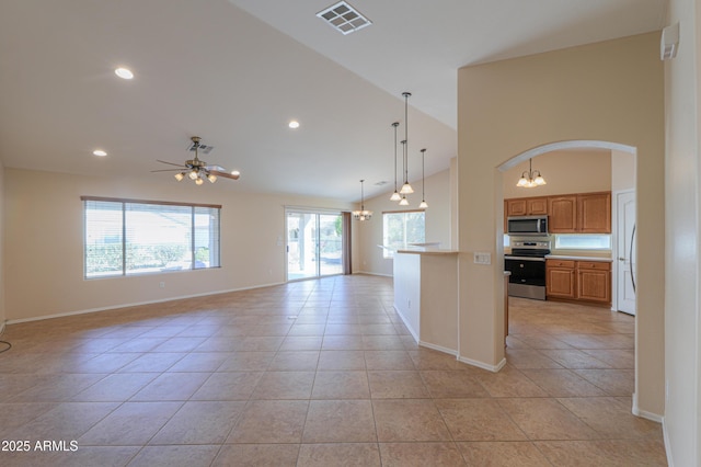 kitchen featuring high vaulted ceiling, ceiling fan with notable chandelier, hanging light fixtures, light tile patterned floors, and stainless steel appliances