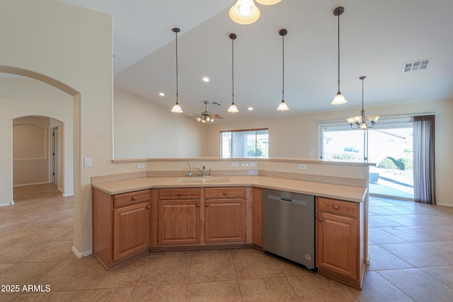 kitchen featuring sink, stainless steel dishwasher, lofted ceiling, light tile patterned flooring, and ceiling fan with notable chandelier