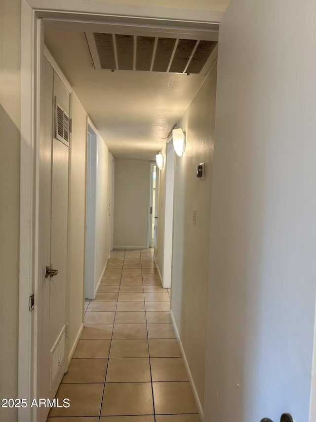 344 E Aepli Dr, Tempe, AZ 85282 - corridor featuring light tile patterned floors and baseboards