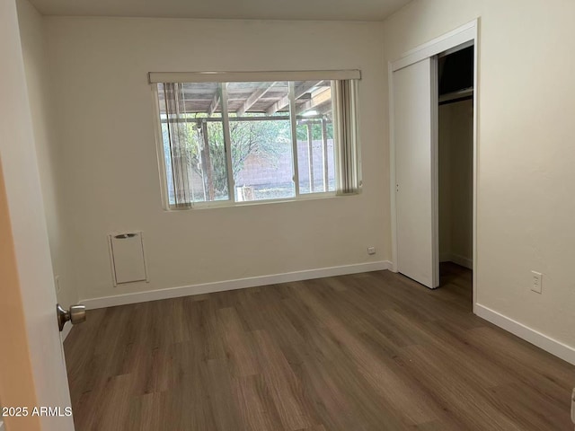 344 E Aepli Dr, Tempe, AZ 85282 - unfurnished bedroom featuring dark wood-type flooring and a closet