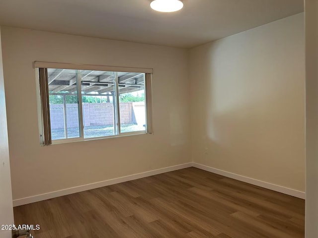 344 E Aepli Dr, Tempe, AZ 85282 - unfurnished room with dark wood finished floors and baseboards