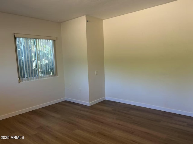 344 E Aepli Dr, Tempe, AZ 85282 - spare room featuring dark wood-type flooring and baseboards