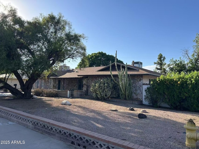 344 E Aepli Dr, Tempe, AZ 85282 - view of front of house featuring stone siding and a chimney