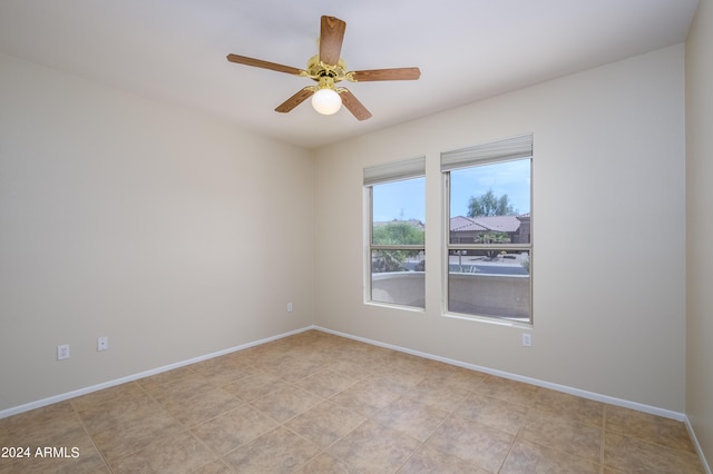 spare room with ceiling fan